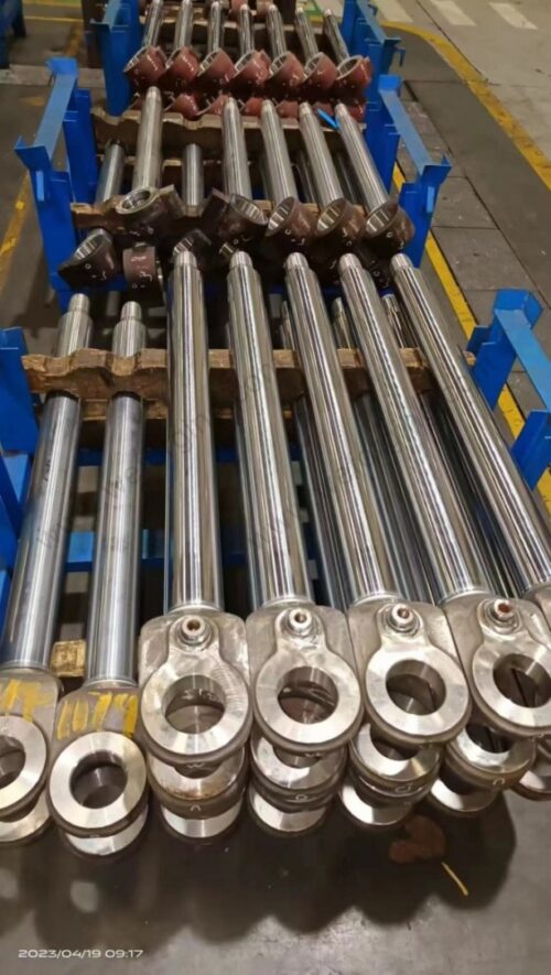 CNC turning operation on forged steel piston rod showing precision machining