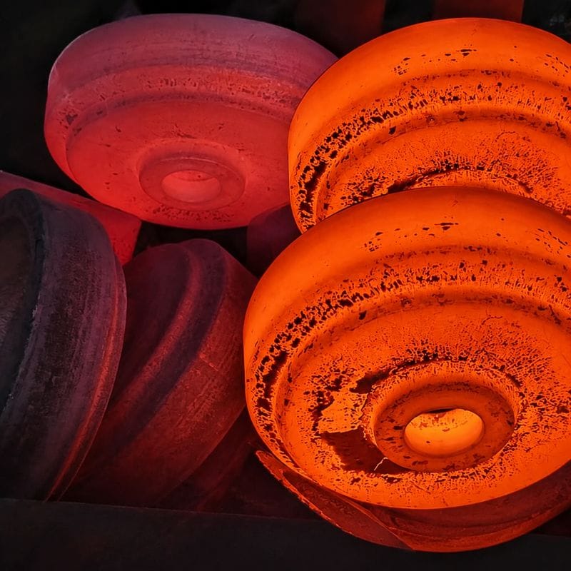 Hot forged rollers for heavy-duty industrial equipment and mining applications