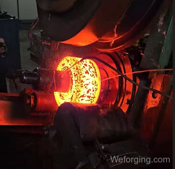 Hot roll forging process showing billet compression between rotating rolls