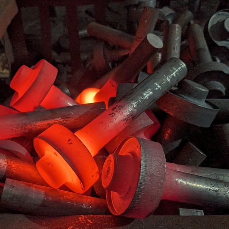 Custom forging process showing heated metal forming for manufacturing industrial forged parts