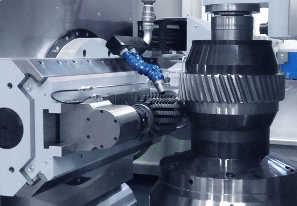 CNC gear hobbing machine cutting gear teeth on forged gear blank