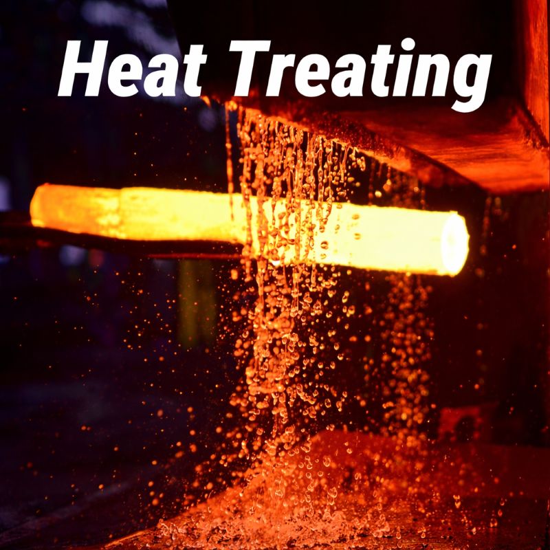 Red-hot metal bar undergoing quenching with water splashing during the heat treating process
