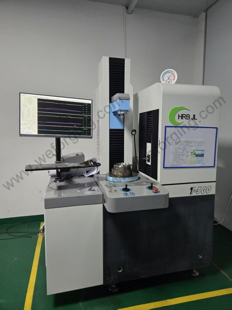 This image shows an optical measurement system used for dimensional inspection at Weforging. The equipment is applied to check external dimensions, profiles, and geometric features of forged and CNC machined components. Optical inspection supports accurate verification against technical drawings and contributes to stable quality control throughout the manufacturing process.