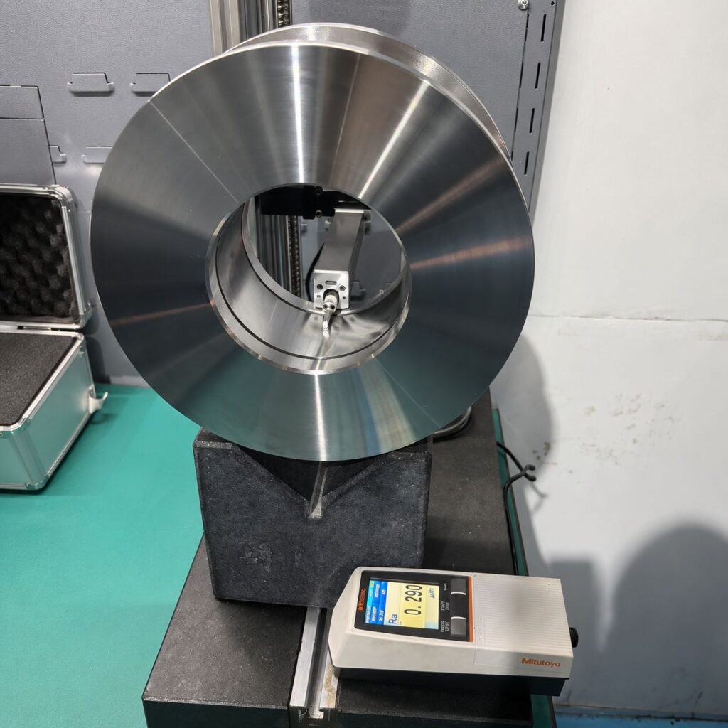 Mitutoyo surface roughness tester measuring Ra value on precision CNC machined component