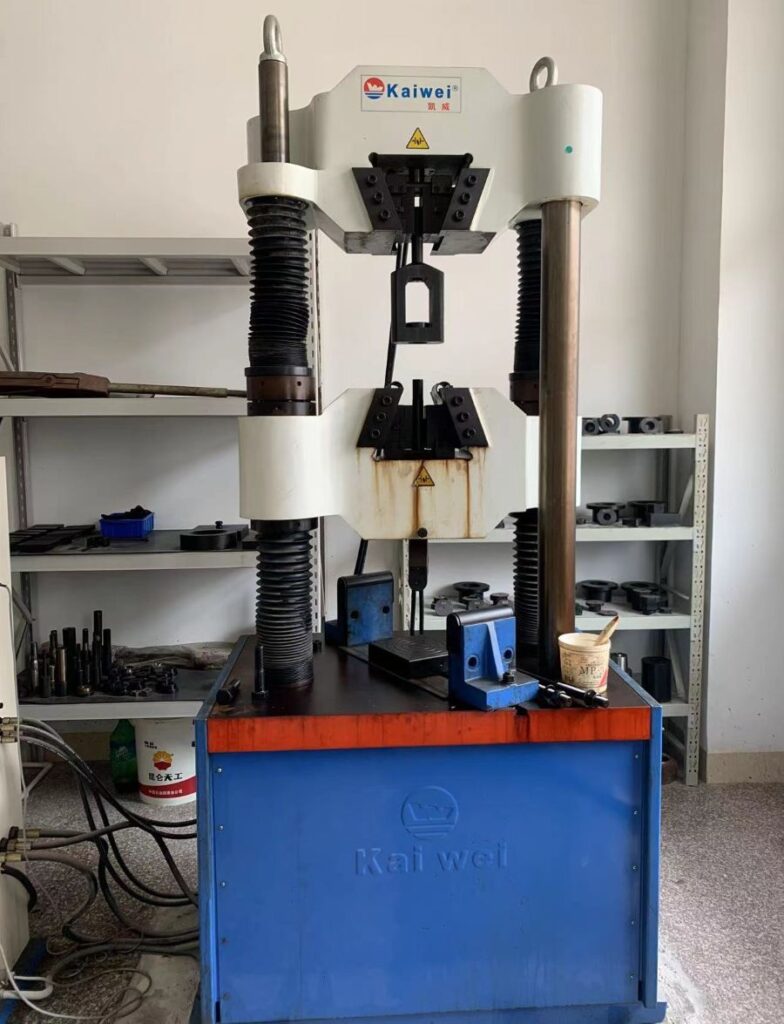 Tensile testing machine used for mechanical testing of forged materials