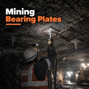 Mining bearing plates installed with rock bolts and mesh in an underground ground support system