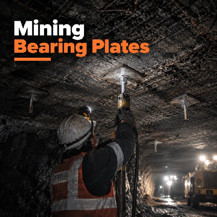 Mining bearing plates installed with rock bolts and mesh in an underground ground support system