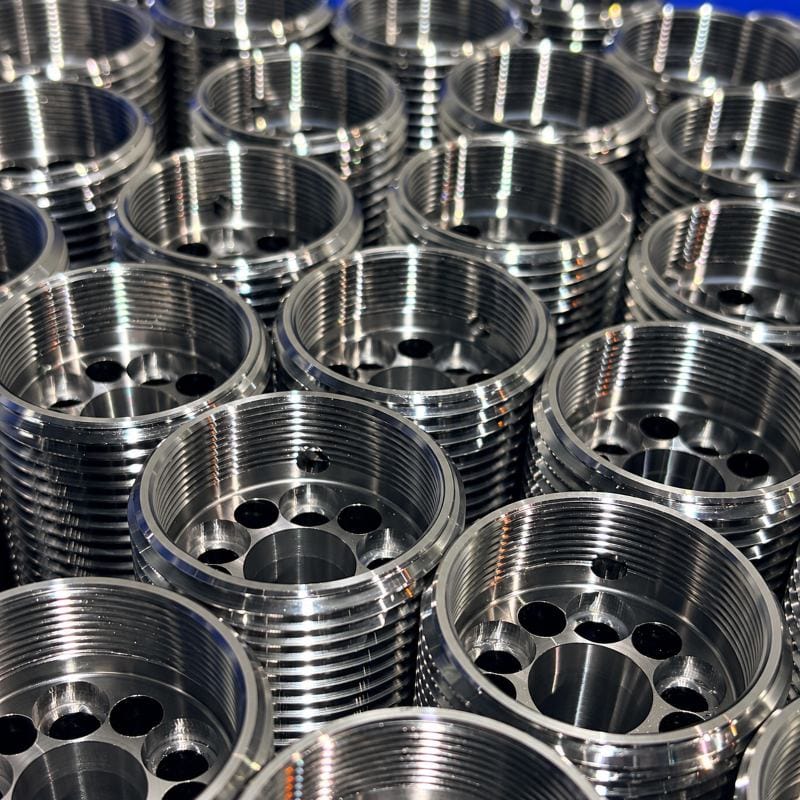 CNC machined anchor heads for mining ground support, manufactured for strength and toughness in load-bearing applications.