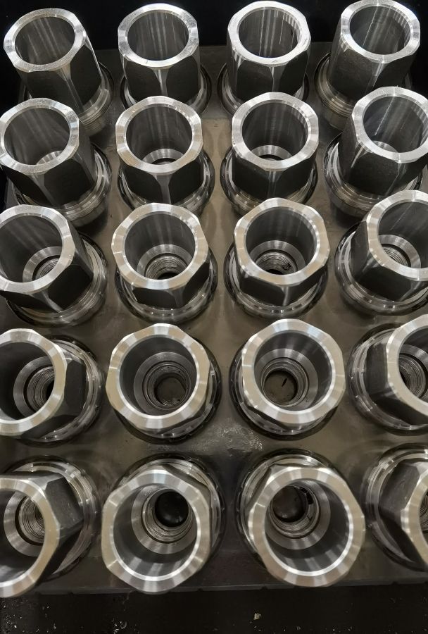 Batch of custom Drive Nuts before ultrasonic cleaning, rust protection and packaging