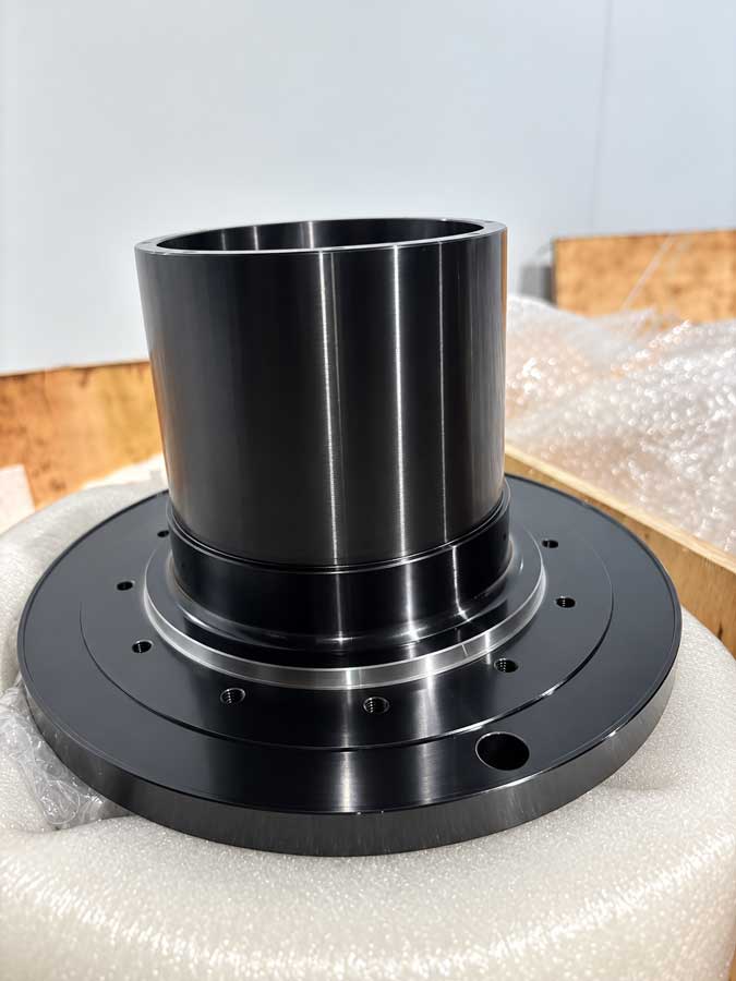 Finished robot joint rotor core with thin-wall bore and machined bearing features