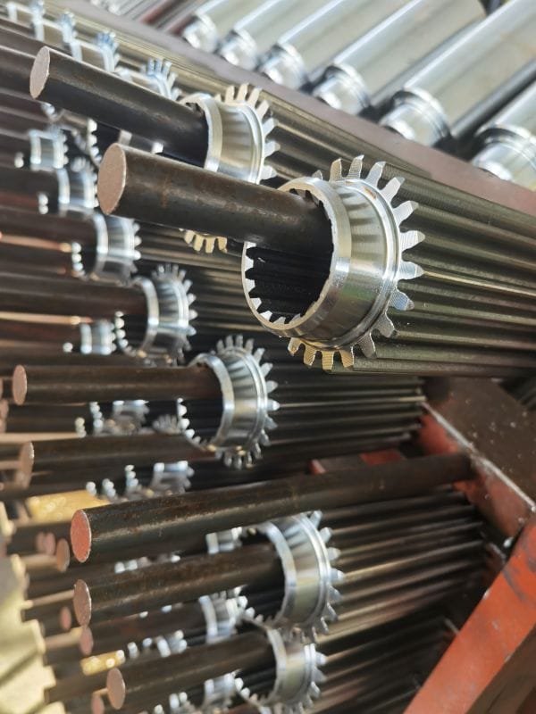 Forged steel gear component with hobbed external teeth and machined internal splines