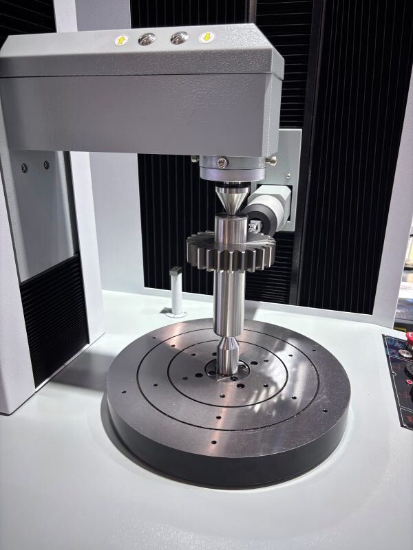 Spur gear shaft mounted on gear inspection equipment for tooth profile and lead measurement